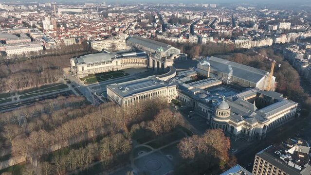 Jubel park, Monument du Cinquantenaire, Brussels, Belgium, touristic attraction, monument, city park. WInter, golden hour. Aerial drone overhead view.