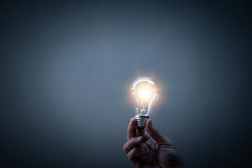 Creativity. Thinking. Innovation. Hand holding a light bulb for ideas. New concept with innovation and technology inspiration. Innovation in science and communication concepts, idea. 