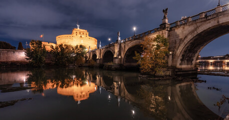 Old Historic Bridge, St. Angelo Bridge, over River Tiber at night. Rome, Italy.