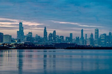 Fototapeta na wymiar Downtown Chicago and Lake Michigan During the Blue Hour as viewed from just off of Lake Shore Drive near the 49th Street Beach