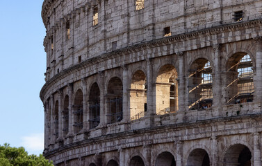 Fototapeta na wymiar Ancient Remains in Rome, Italy. Colosseum. Sunny Cloudy Sky.