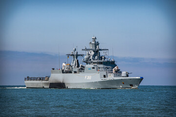 Fototapeta na wymiar a warship returning to its port