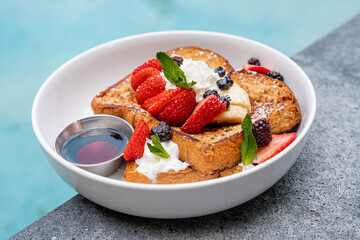 french toast with berries in a hotel
