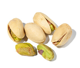 Salted open inshell pistachios isolated on a white background, tasty and healthy snack