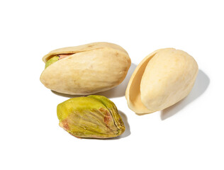 Salted open inshell pistachios isolated on a white background, tasty and healthy snack