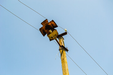 Power electric pole with line wire on colored background close up