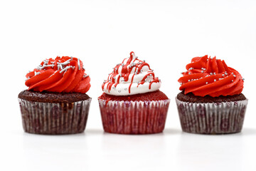 creamy cupcake in shades of red on white background