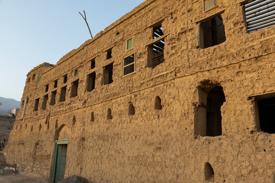One of the old houses where people used to live, which were built with mud and traditional wooden windows in Al Hamra, oman
