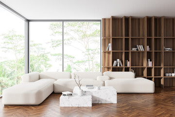 Front view on bright living room interior with panoramic window