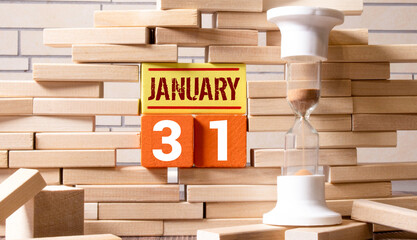 Cube shape calendar for January 31 on wooden surface with empty space for text,