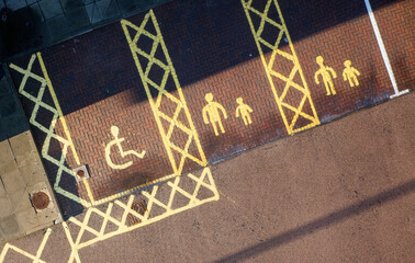 Disabled and parent, children parking spaces act school entrance