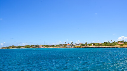 A beautiful coastal view on Aruba island from Caribbean sea. Space for text.	