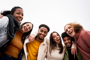 Fototapeta Happy friends from diverse cultures and races taking selfie looking at camera outdoors. Cheerful people having fun. High quality photo obraz