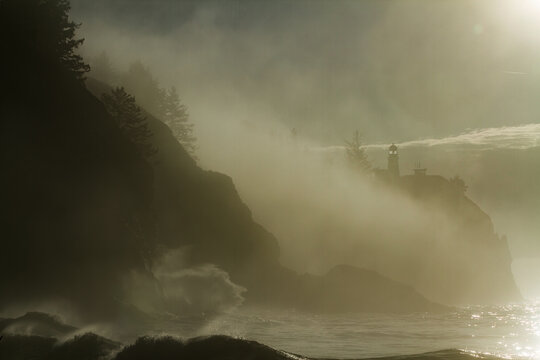 Cape Disapointment Lighthouse on a foggy morning  at hte mouth of the Columbia River on the Washington coast