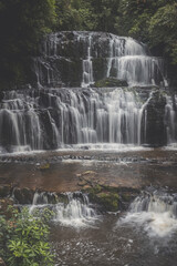 Wide waterfall among trees