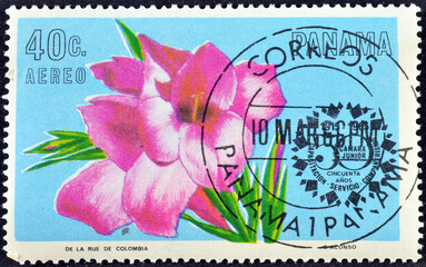 Cancelled postage stamp printed by Panama, that shows Gladiolus splendens flower, promoting Chamber of Commerce, 50th Anniversary, circa 1966. - obrazy, fototapety, plakaty