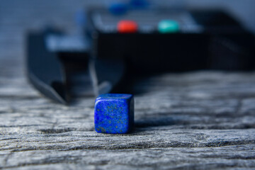 Lapis Is a beautiful natural gemstone on a wooden floor