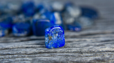 Lapis Is a beautiful natural gemstone on a wooden floor