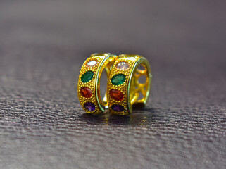 Gold Gold earrings with multi-colored stones, expensive jewelry.