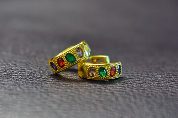 Gold Gold earrings with multi-colored stones, expensive jewelry.