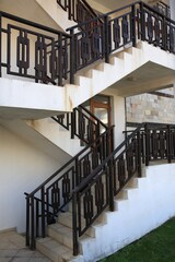 View of beautiful stairs with metal handrails near house outdoors
