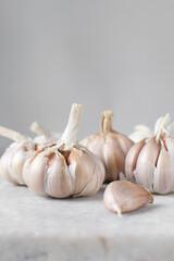 Garlic bulbs on a marble tray, garlic, raw garlic, Allium sativum