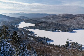 A winter morning seen from La Roche look point at Mont-Tremblant Nation Park in Quebec, Canada - obrazy, fototapety, plakaty