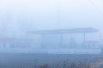 A petrol station in thick fog in Pakistan with zero visibility