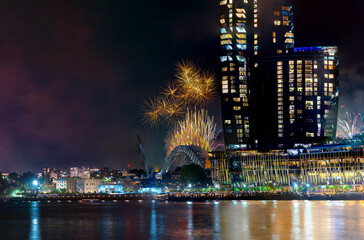 Sydney Harbour Bridge New Years Eve fireworks, colourful NYE fire works lighting the night skies with vivid multi colours NSW Australia. Happy New Year. New Year Eve