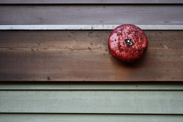 red rusted fire alarm