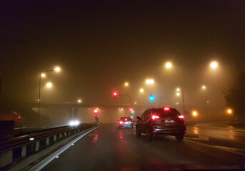 Obraz na płótnie Canvas road cars in fog foggy night lights in egnatia stree greece