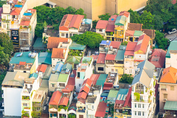 Aerial view of brightly coloured rooftops and houses at Hanoi in Vietnam