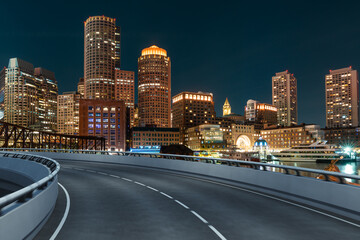 Obraz premium Empty urban asphalt road exterior with city buildings background. New modern highway concrete construction. Concept of way to success. Transportation logistic industry fast delivery. Boston. USA.