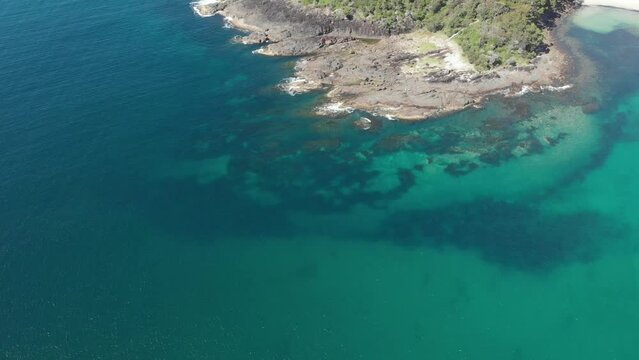 Drone video flying over Barry Park lookout toward Fingal Head on a bright spring day