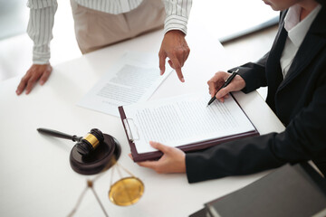 Lawyer discuss the contract and legal document agreement in office. Law and legal concept