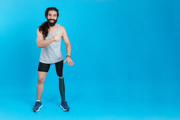 Fototapeta na wymiar Man with a prosthesis on the leg pointing aside