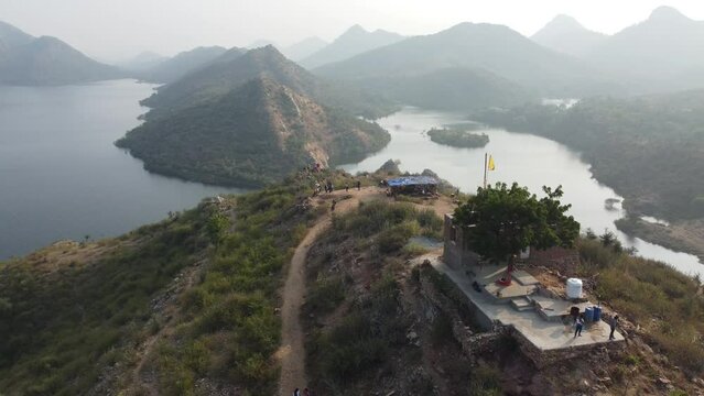 Bahubali Hills, Udaipur, Rajasthan, India 28th December 2022: Popular prewedding destination and trekking spot near Udaipur. 4k Aerial view of Bahubali hill and Badi lake near Barda village
