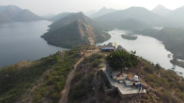 Bahubali Hills, Udaipur, Rajasthan, India 28th December 2022: Popular prewedding destination and trekking spot near Udaipur. 4k Aerial view of Bahubali hill and Badi lake near Barda village