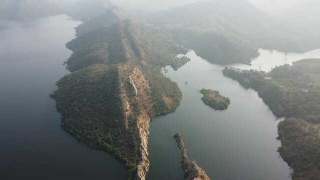 Bahubali Hills, Udaipur, Rajasthan, India 28th December 2022: Popular prewedding destination and trekking spot near Udaipur. 4k Aerial view of Bahubali hill and Badi lake near Barda village