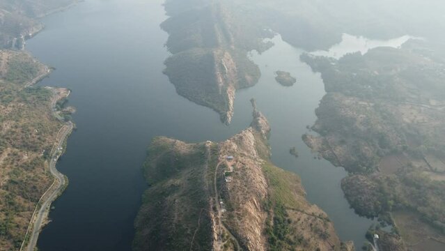 Bahubali Hills, Udaipur, Rajasthan, India 28th December 2022: Popular prewedding destination and trekking spot near Udaipur. 4k Aerial view of Bahubali hill and Badi lake near Barda village