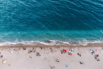 Fototapeta na wymiar Aerial beach view with mediterranean sea resort. Paradise riviera and vacations in summer