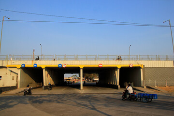 Surabaya, Indonesia, Oct 29, 2015. Crossing road or underpass under the flyover to facilitate...
