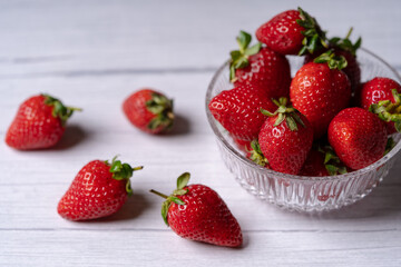 Fresh Organic Strawberries on a white wooden surface