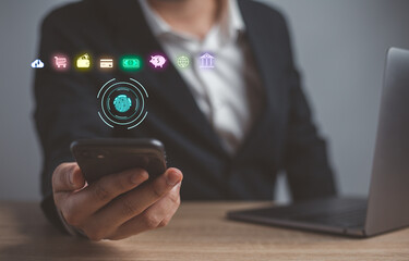 Businessman working on smartphone modern computer show padlock protecting business and financial data. Man using mobile smart phone with global network connection,  