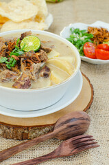 Indonesian Soto, Traditional Food with soup and meats. Complete with crackers