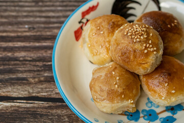 Phuket Thailand snack food, Tao Sor is a local dessert of Phuket. Originating from Hokkien Chinese, Popular to buy as a souvenir. Put a plate on an antique wooden table, with selective focus.