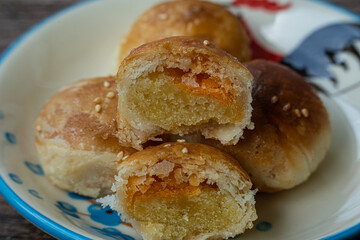 Phuket Thailand snack food, Tao Sor is a local dessert of Phuket. Originating from Hokkien Chinese, Popular to buy as a souvenir. Put a plate on an antique wooden table, with selective focus.