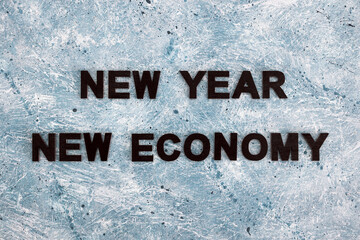 new year new economy text on blue