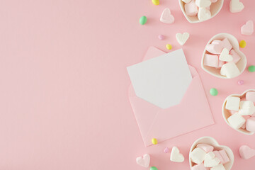 Valentines Day concept. Flat lay photo of envelope with letter, heart shaped saucers with candies...