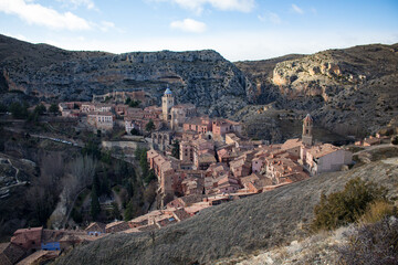 Old Spanish town hidden in the mountains with red houses and churches, Albarracin